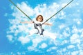 Girl Bungee Jump Against Blue Sky