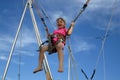 Girl bungee jumping on a trampoline