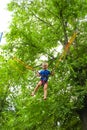 Girl bungee jumping in trampoline Royalty Free Stock Photo