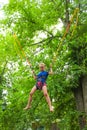 Girl bungee jumping in trampoline