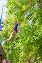 Girl bungee jumping in trampoline Royalty Free Stock Photo