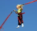 Girl on bungee trampoline Royalty Free Stock Photo