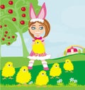 Girl in bunny costume and sweet small chicks