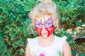 Girl with butterfly face painting Royalty Free Stock Photo