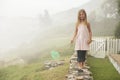 Girl With Butterfly Net Balancing On Stone Wall Royalty Free Stock Photo