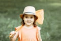 Girl with butterfly net having fun at field. Child catching butterflies and exploring nature. Summer concept. Royalty Free Stock Photo