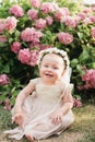 girl with butterfly wings in hydrangea park Royalty Free Stock Photo