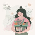 Girl buys fresh vegetables and fruits in grocery. Woman holding basket with set of organic food