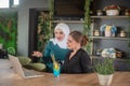 Girl in caffe typing on laptop and relaxing Royalty Free Stock Photo