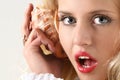 Girl call by shell phone Royalty Free Stock Photo