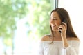 Girl calling on phone landline at home