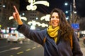 Girl calling taxi in urban environment Royalty Free Stock Photo