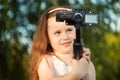Girl with a camera and stabilizer removes.
