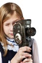 Girl cameraman filming with retro camera