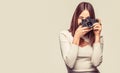 Girl with a cameras. Woman holding camera over gray background. Girl using a camera photo. Photographer camera photo Royalty Free Stock Photo