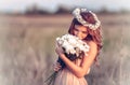 Girl in a camomile wreath Royalty Free Stock Photo