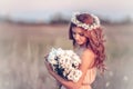 Girl in a camomile wreath Royalty Free Stock Photo