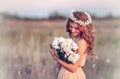 Girl in a camomile wreath Royalty Free Stock Photo