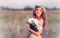 Girl in a camomile wreath Royalty Free Stock Photo