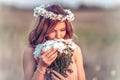 Girl in a camomile wreath Royalty Free Stock Photo