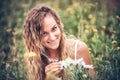 Girl with camomiles bouquet Royalty Free Stock Photo