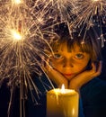 Girl with a candle and sparkler