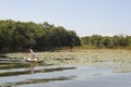 Girl on canoe at isla de las flores on river Dulce