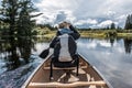Girl canoeing with Canoe on the lake of two rivers in the algonquin national park in Ontario Canada on sunny cloudy day Royalty Free Stock Photo