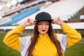 Girl in a cap at an empty stadium Royalty Free Stock Photo