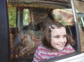 Girl and car window Royalty Free Stock Photo