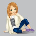 Girl In Cardigan And Jeans Sits Royalty Free Stock Photo