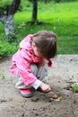 Girl is careful exploring the snail Royalty Free Stock Photo