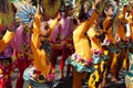 Girl carnival dancer in ethnic costumes dances in delight along the road