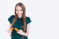 Girl with carrot halves Royalty Free Stock Photo