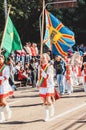 Girl carrying the Campo Grande flag at the celebration of the 119 years of the city