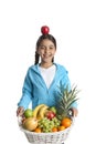 Girl carrying a fruit basket Royalty Free Stock Photo