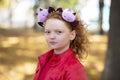 A girl in casual clothes and with a headband with Halloween horns Royalty Free Stock Photo