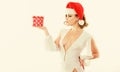 Girl celebrate christmas. Girl wear santa claus hat. Gift from santa. Woman attractive lady wear sexy dress and santa Royalty Free Stock Photo