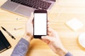 Girl with cell phone with blank screen, laptop, headphones and p Royalty Free Stock Photo