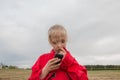 Girl with cell phone and cloudy sky Royalty Free Stock Photo