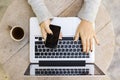 Girl with cell phone, laptop and cup of coffee Royalty Free Stock Photo