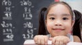 girl with chalk drawing Mathematical calculations on blackboard Royalty Free Stock Photo