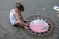 Girl chalking the street Royalty Free Stock Photo