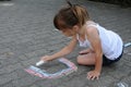 Girl chalking the street Royalty Free Stock Photo