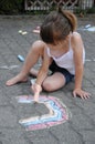 Girl chalking the street Royalty Free Stock Photo