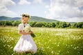 Girl with chamomile wreath in summer field Royalty Free Stock Photo