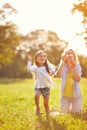 Girl chase shinny soap bubbles Royalty Free Stock Photo