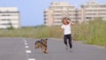 Girl chasing her puppy