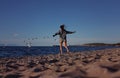 Girl chasing seagulls on beach