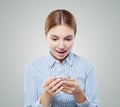 Girl chatting with phone. Surprised woman cellphone, good news Royalty Free Stock Photo